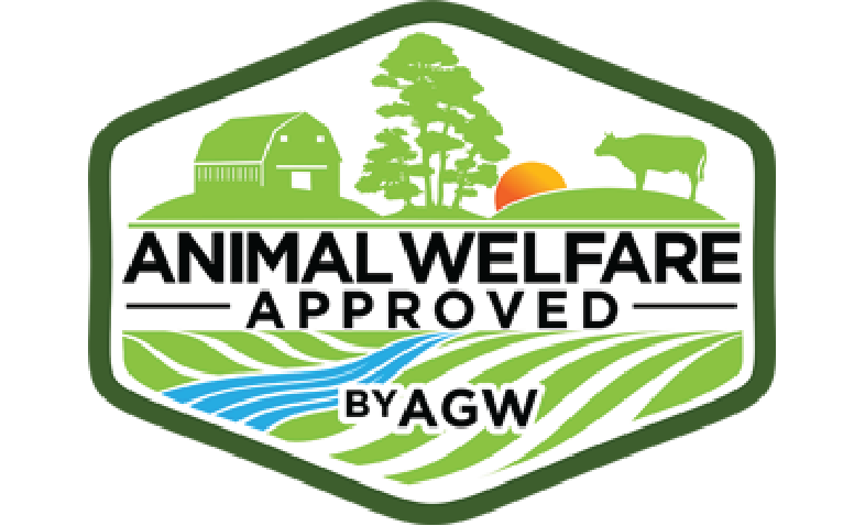 Animal Welfare Approved certification badge by AGW featuring a farm landscape with a barn, trees, sun, and a cow, symbolizing ethical and humane animal farming practices.